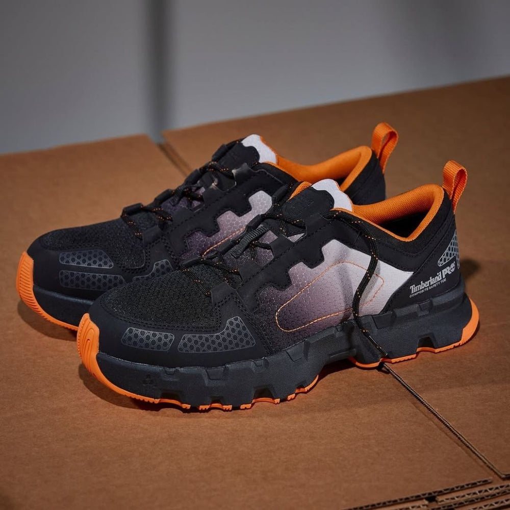 Timberland PRO Men's Powertrain EV Composite Toe Athletic Work Shoe in black with orange accents, featuring a lace-up closure and a rubber outsole.